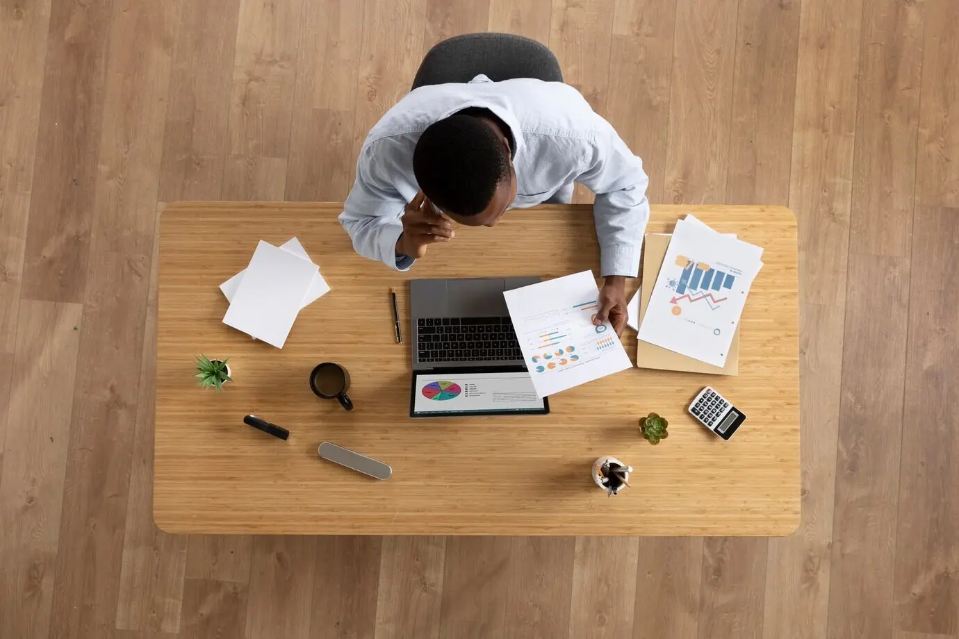 Top-down view of a man working at the office.